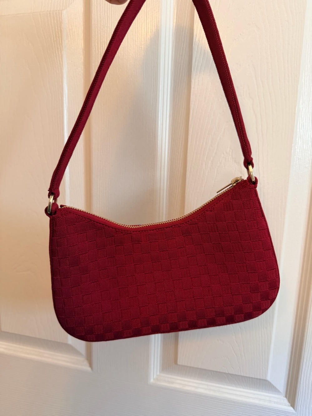 Rothy's deep red woven shoulder bag with gold zipper